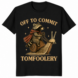 Funny raccoon meme shirt in black with a caped raccoon riding a snail, off to commit tomfoolery