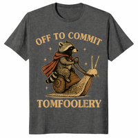 Funny raccoon meme shirt in dark heather with a caped raccoon riding a snail, off to commit tomfoolery