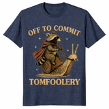 Funny raccoon meme shirt in heather navy with a caped raccoon riding a snail, off to commit tomfoolery