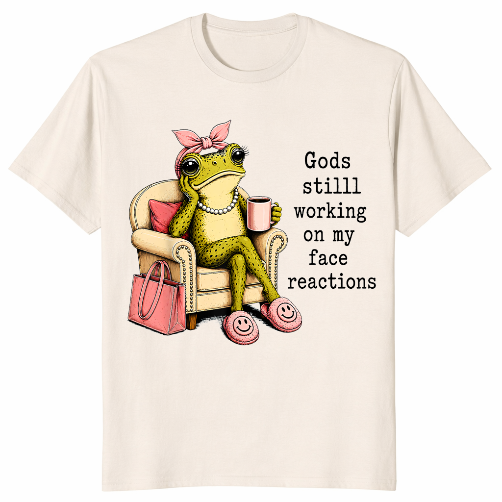 Natural God's Still Working On My Face shirt with an unimpressed frog holding coffee