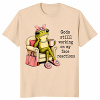 Sand God's Still Working On My Face shirt with an unimpressed frog holding coffee