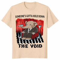 Someone’s Gotta Hold Down The Void shirt in sand with surreal elephant design