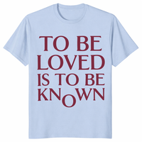 To Be Loved Is To Be Known Shirt in light blue with romantic minimalist text graphic