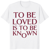 To Be Loved Is To Be Known Shirt in white with minimalist burgundy quote text