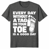 Toe tag shirt reading every day without a tag on your toe is a good day, dark heather