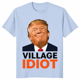 Village Idiot Trump graphic shirt with bold orange text