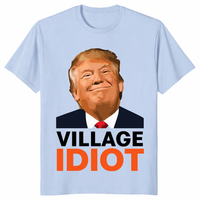 Village Idiot Trump graphic shirt with bold orange text