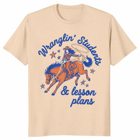 Wranglin students shirt in sand